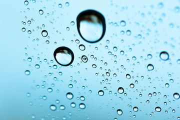Water drop under water on background.