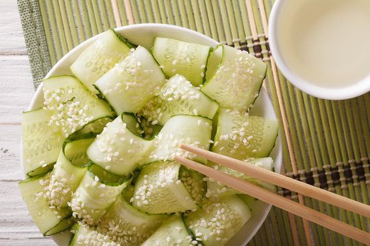 Japanese sunomono salad with fresh cucumber close up. Horizontal top view
