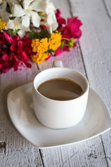 Cup of coffee with flowers