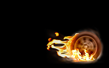 Car racing spinning wheel burns rubber on fire.