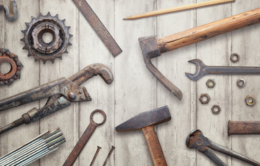 Old vintage tools on wooden table. Traditional handmade tools for craftsmen.