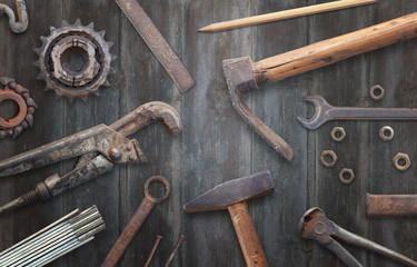 Old vintage tools on wooden table. Traditional handmade tools for craftsmen.