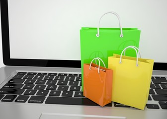 laptop and  shopping pags on white background. 3d rendering.