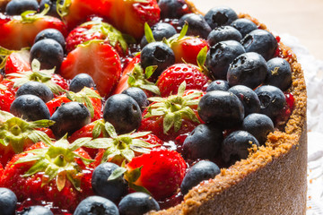 cheese cake with strawberries and blueberries