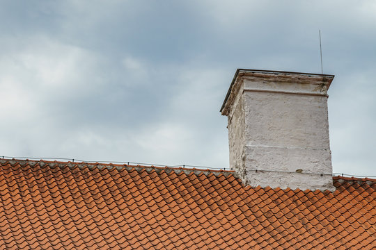 Tiled roof and chimney with lightning rod