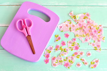Lilac wooden cutting board. Home made chopping board kitchen decor. Paper napkin, cut paper napkin flowers, scissors. Materials for decoupage project, recycled diy 