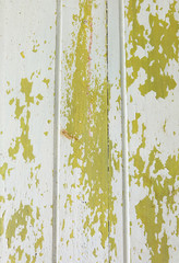 The paint of woods is peeling off wallpaper