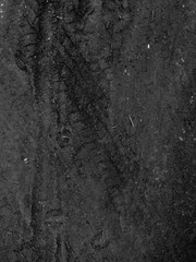 Tire tracks on the black road gravel stone background