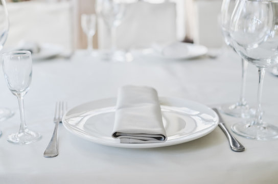 Empty Plate and Glass in Restaurant