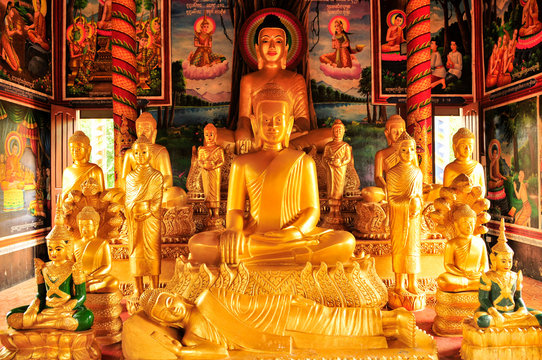 Golden Buddhas inside a temple