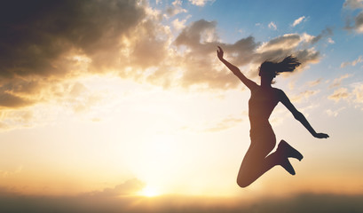 Young woman enjoying outdoors, sky background