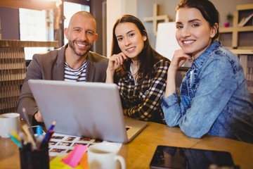 Portrait of graphic designer team working on laptop