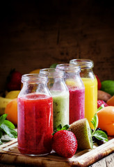 Multi-colored fruit and berry drinks, selective focus