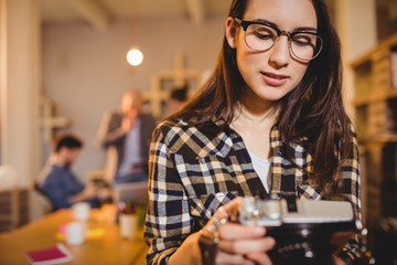 Graphic designer checking pictures in camera