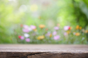Fototapeta premium outdoor wooden table view with flowers