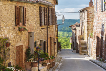 Fototapeta na wymiar Summer streets in the medieval Tuscan town.