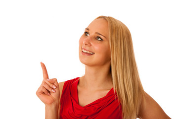 business Woman in red shirt  pointing into copy space isolated o