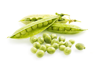 Fresh green peas on white