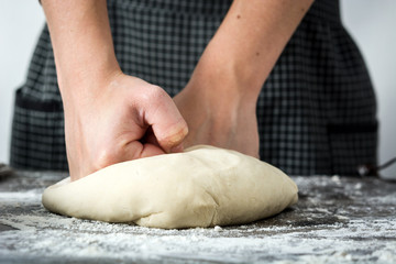 Woman making bread with her hands


