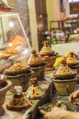 Fototapeta na wymiar Selection of very colorful Moroccan tajines (traditional cassero