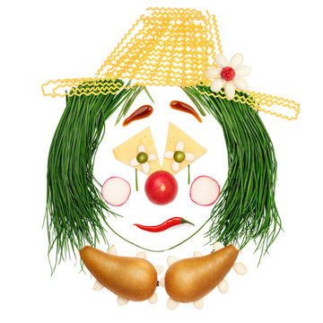 Sad fruity clown / Dramatic clown made of vegetables and fruits in a kids menu isolated on white.