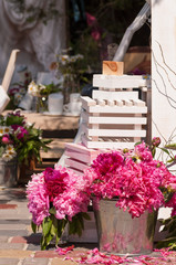 peonies in the bucket and a white guitar
