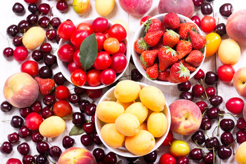 fresh fruits and berries on wooden table