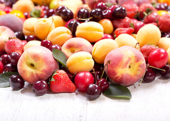 Naklejka na ściany i meble fruits and berries on wooden table