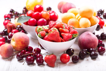 bowls of fresh fruits and berries