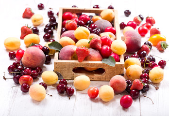 fresh fruits and berries on wooden table