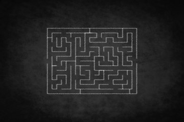 problem  concept , labyrinth on  black chalkboard