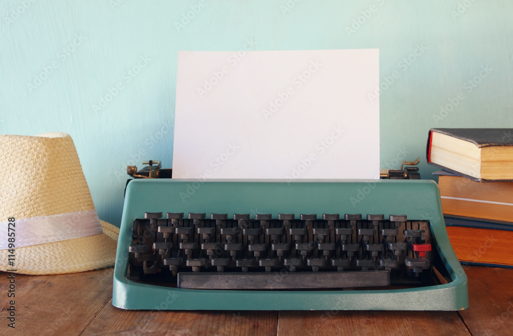 Wall mural Photo of vintage typewriter with blank page - Wall murals