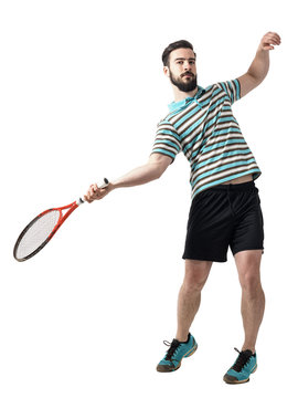 Action shot of tennis player hit ball in forehand pose. Full body length portrait isolated over white studio background.