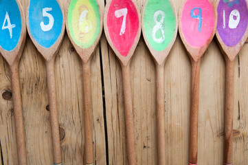 numbered wooden spoons in sequence for cafe menu background