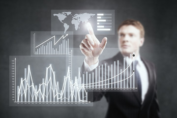 Businessman pointing at business chart