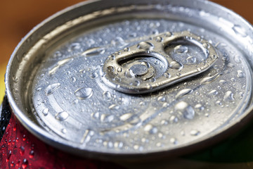 Top part of beer cans with water drops.Close up view