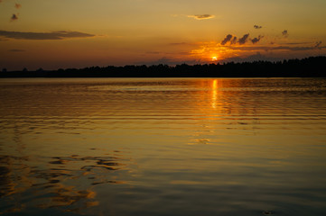 beautiful sunset with the reflection of the sun ray in water