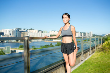 Young woman doing warm up exercise