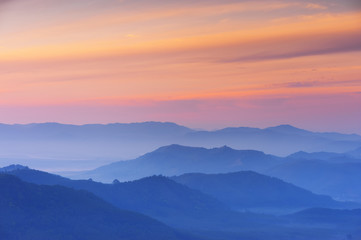 Naklejka na ściany i meble Sunrise Scene of Mountain and Fog
