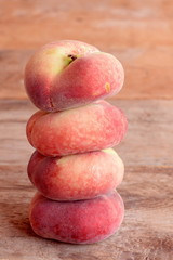 Fresh ripe figs peaches on the old wooden background. Juicy delicious fruits. Closeup