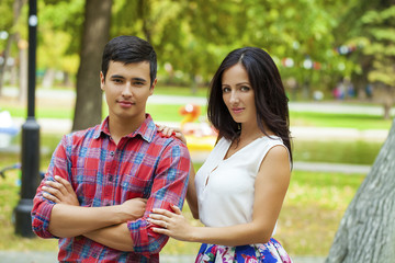 Fototapeta premium Beautiful young loving couple standing outdoors