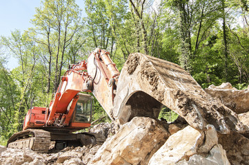 Excavator with big shovel to work with rocks