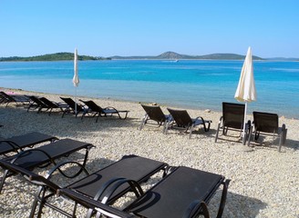 Sun loungers on the beach in Vodice.