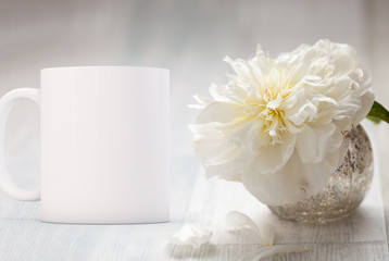 Fototapeta na wymiar White blank coffee mug ready for your custom design/quote.