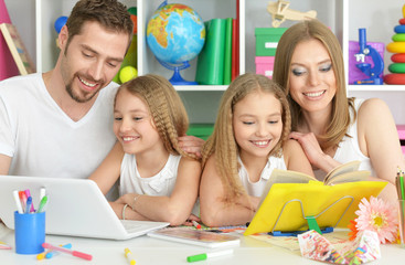 Fototapeta premium happy family with laptop