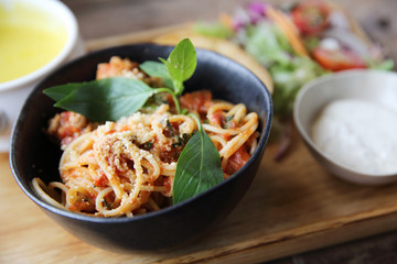 spaghetti and meatballs on wood background italian food