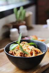 spaghetti and meatballs on wood background italian food