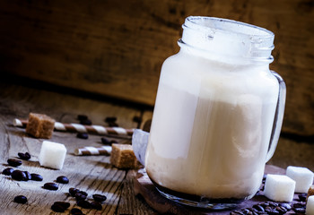 Coffee with ice-cream in a large jar, selective focus