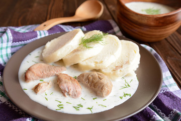 Turkey meat with dill sauce and bread dumpling