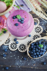 Obraz na płótnie Canvas Delicious bilberry smoothie, detox yogurt or milkshake with fres